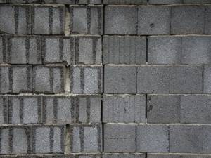 Lavori di ristrutturazione e muri perimetrali in cemento armato: perché la spesa deve essere ripartita tra tutti i condomini?